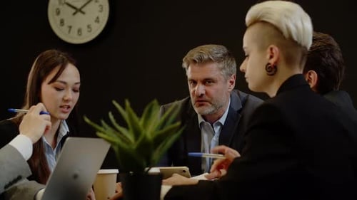 Team Meeting in Corporate Office Setting