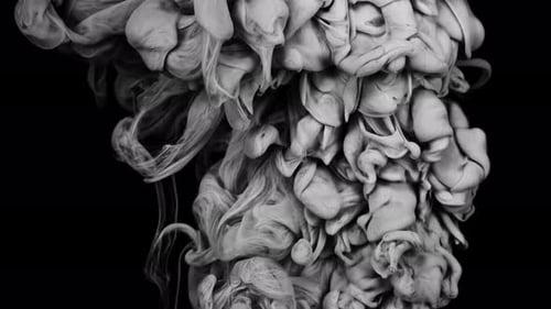 Rising Gray Smoke Swirls on a Black Background