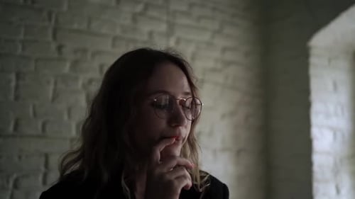 Young Woman Working on Her Laptop Computer in Coffee Shop