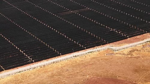 Aerial View of Vast Solar Panel Field
