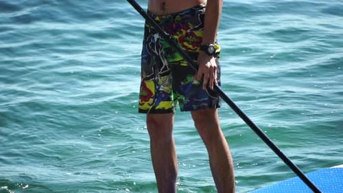 Man Sup Sea Strong Athletic Man Learns to Paddle Sup Standing on Board in Open Sea Ocean on Sunny