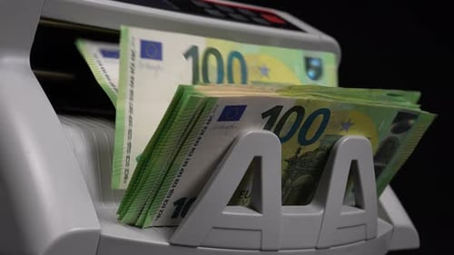 Euro Bills Being Counted in Money Counter Machine