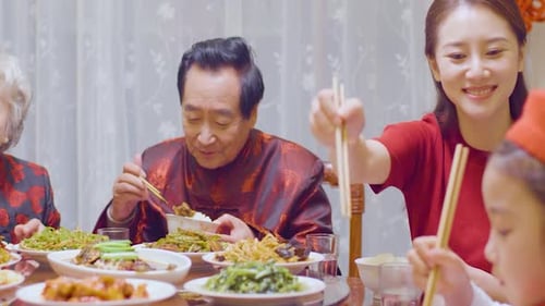 Family Meal Together at Home With Chopsticks