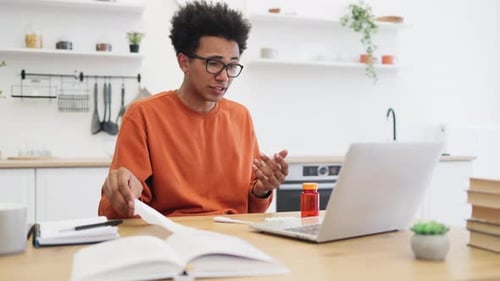 Young Man with Cold Consults Doctor Online