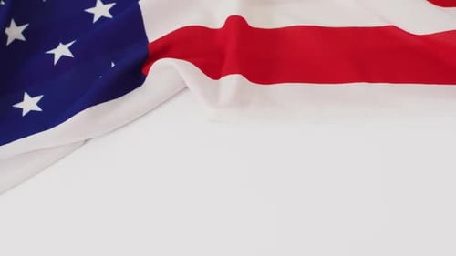 American Flag Waving Against White Background