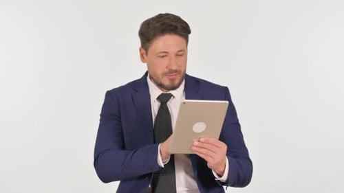 Professional Man Using Tablet in Studio Setting