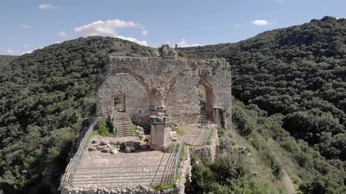 Monfort fortress ancient structure on ridge aerial view, 2022
