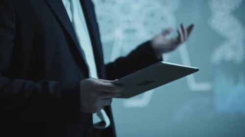 Businessman Presenting with Tablet in Modern Office
