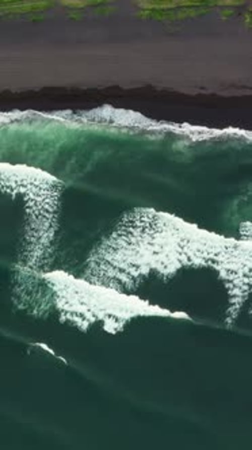 Aerial Top View of Beach with Black Sand