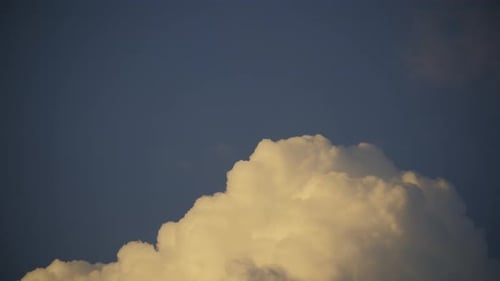 White Changing Clouds with Blue Sky Background of Fluffy Cumulative Storm Clouds on Blue Sky