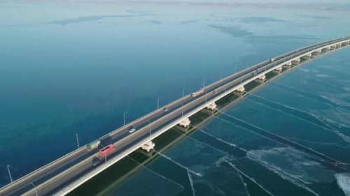 Aerial Drone View of Lowwater Bridge Across the Bay with Moving Car Active Movement of Transport
