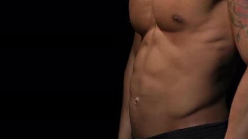 Close Up Man Showing a Perfect ABS