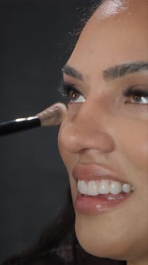 Close-up Applying Makeup with a Brush