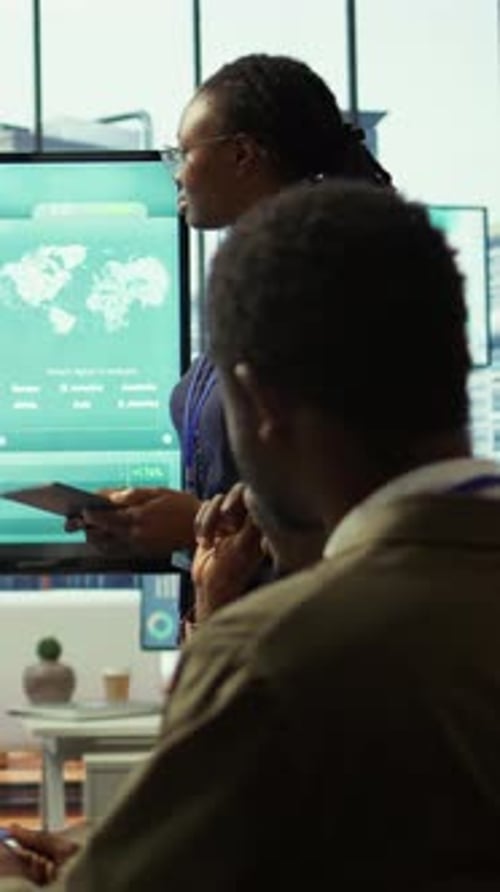 Business Professionals Discussing Global Data in Modern Office