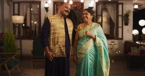 Happy Couple Smiles at Home During Diwali Celebration