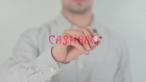 Man Writes Cashback on Transparent Surface with Marker