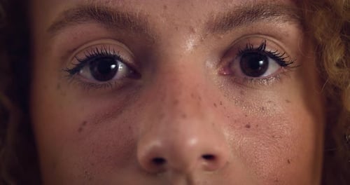 Close Up Macro Zoom Shot of an Eye. Smiling Young Beautiful Female Looking at t