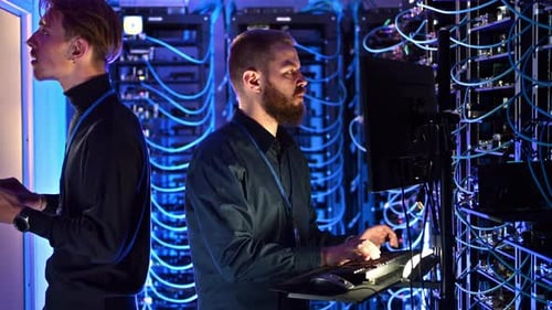 Men Working in a High Tech Server Room