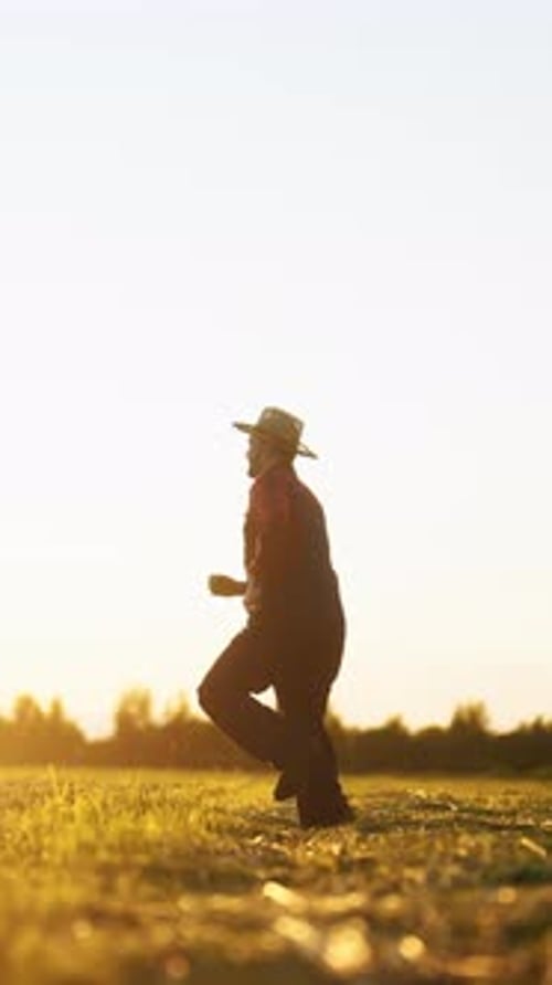 Joyful Carefree Villager Running and Jumping in Beautiful Agricultural Field in Summer Feel
