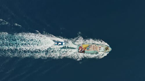 Fishing Boat Sailing In Deep Blue Sea