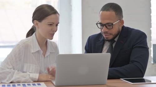 Colleagues Collaborating in an Office Environment