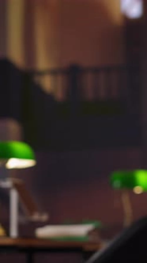 Green Banker's Lamp on a Desk at Night