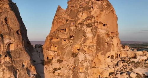 Aerial View of Natural Rock Formations in the Sunset Valley with Cave Houses in Cappadocia Turkey