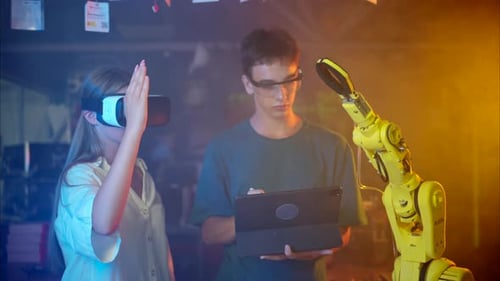 Robotics Students Working with VR and Robotic Arm