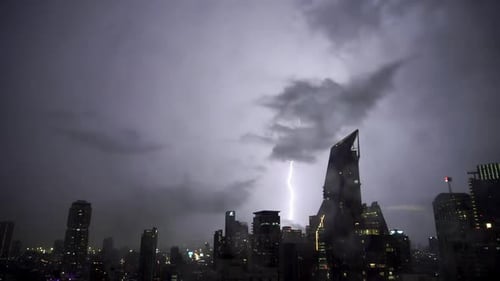 Real flashes of lightning over the city during a powerful thunderstorm.