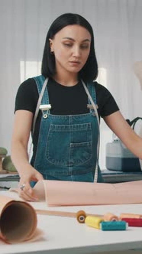Woman Designing Clothes in Studio
