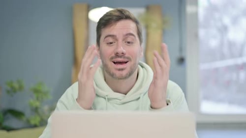 Close Up of Young Man Doing Video Chat on Laptop
