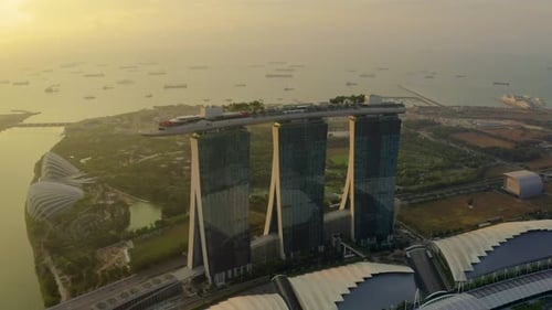 Drone Aerial view 4k Footage of the Marina Bay Sands in Singapore City Skyline. Sunrise