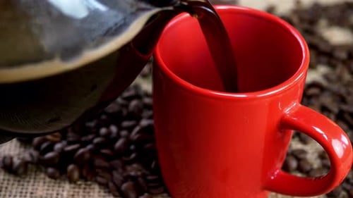 Fresh Coffee Poured into a Red Mug