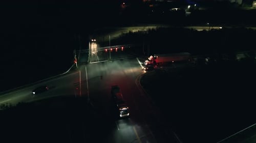 Aerial View Of Dartmouth Cars Drive In Dark Road Junction Lit By Headlights