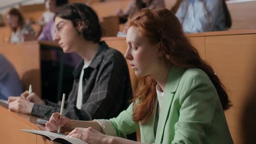 Students learn together at university lecture hall in modern education