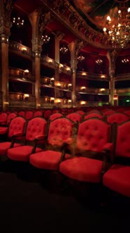 Elegant Red Theater Seats Await the Performance of a Grand Opera Evening