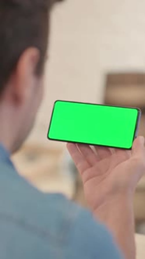 Mature Man Holding Phone with Chroma Key Screen, vertical video