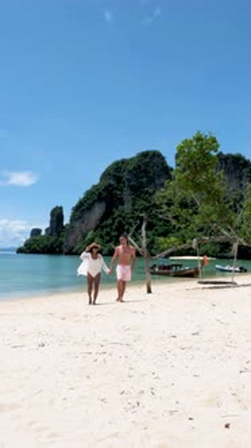 Couple Men and Women on a Tropical White Beach in Thailand Koh Hong Island Krabi