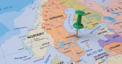 Sweden - Travel concept with green pushpin on the world map. The location point on the map points to