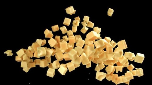 Maasdam Cheese Flies Up and Falls Down on a Black Background Filmed on a Highspeed Camera at 1000