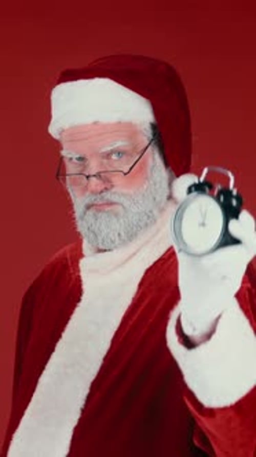 Santa Claus Holding an Alarm Clock
