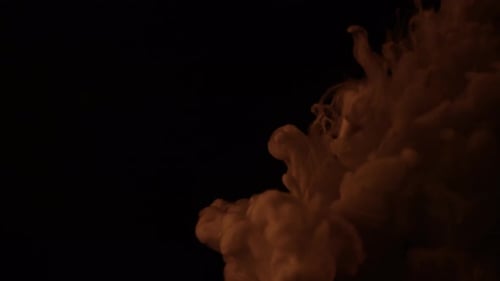 Milk pouring into coffee slow motion.