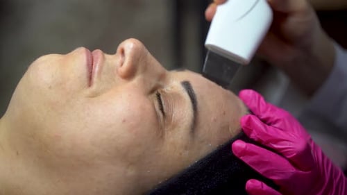 Woman Receiving Facial Skin Treatment Close Up