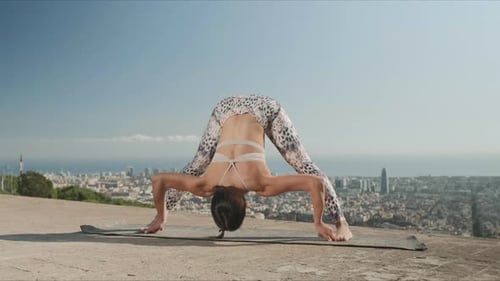 Happy Woman Stretching Body at City Background. Athletic Girl Doing Yoga Pose