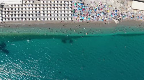 Aerial View of Crowded Beach on Summer Day