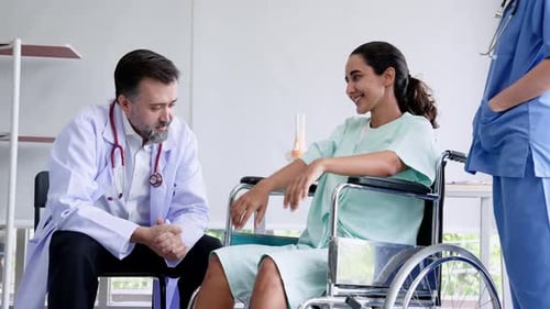 Happy Patient Giving Doctor Thumbs Up in Hospital