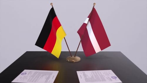 Flags of Germany and Latvia on Table