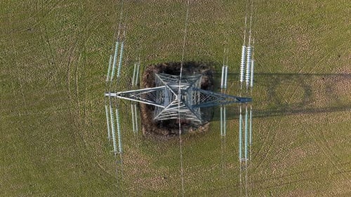 Bird's Eye View of Industrial High Voltage Lattice Power Line Tower
