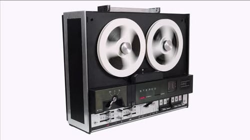 Retro Reel-to-Reel Tape Recorder Spinning on White