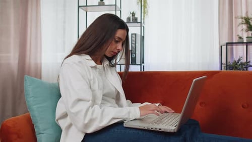 Woman Working on Laptop Then Smiling